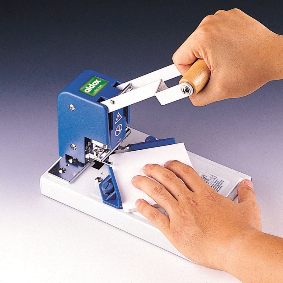 Operator rounding a stack of cards on the Desktop Corner Cutter