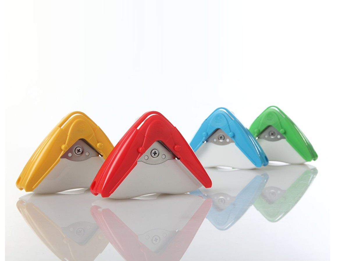 Four hand-held corner cutters in yellow, red, blue and green